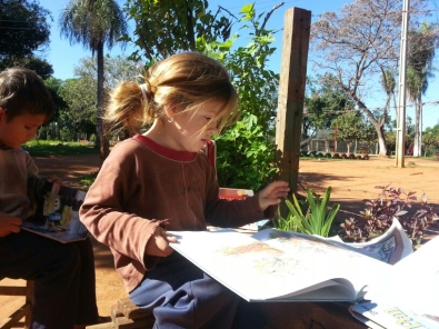 Elena demostrating the use of a fuel efficient cookstove in Guatemala